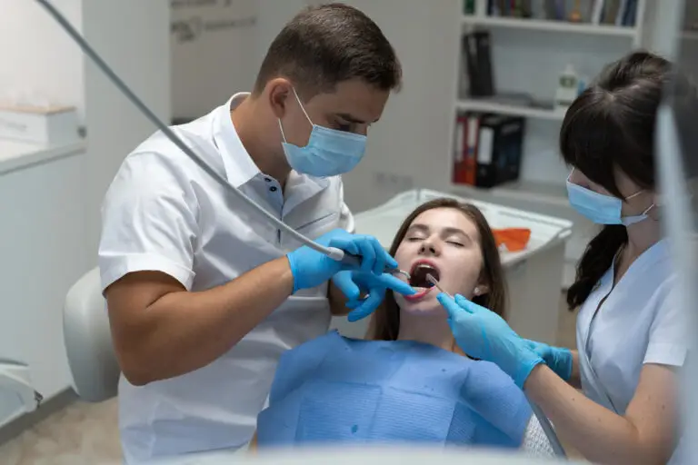 Periodontal disease treatment with a dentist providing gum disease care to a patient in a dental clinic.