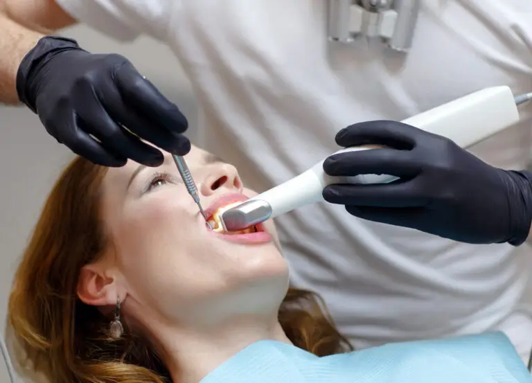 Dentist examining patient during a bone grafting procedure for guided bone regeneration and dental implant treatment planning